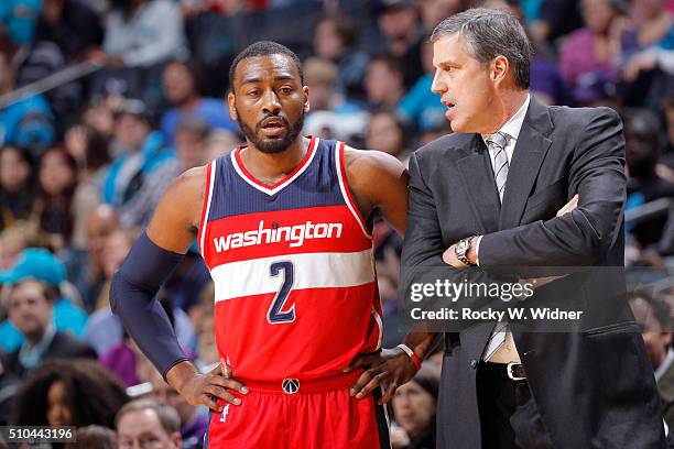 Head coach Randy Wittman of the Washington Wizards coaches John Wall against the Charlotte Hornets on February 6, 2016 at Time Warner Cable Arena in...