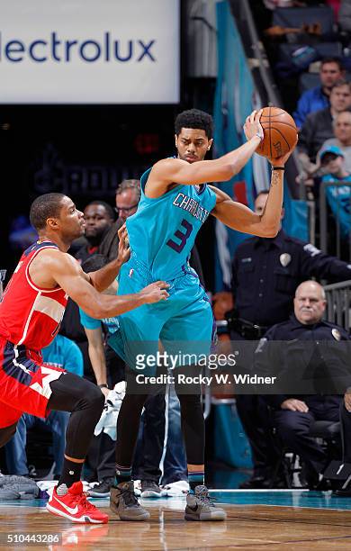 Jeremy Lamb of the Charlotte Hornets handles the ball against Gary Neal of the Washington Wizards on February 6, 2016 at Time Warner Cable Arena in...