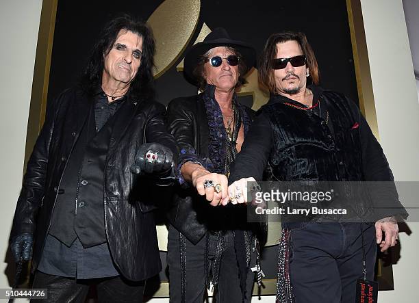 Singer Alice Cooper, musician Joe Perry and actor/singer Johnny Depp of Hollywood Vampires attend The 58th GRAMMY Awards at Staples Center on...