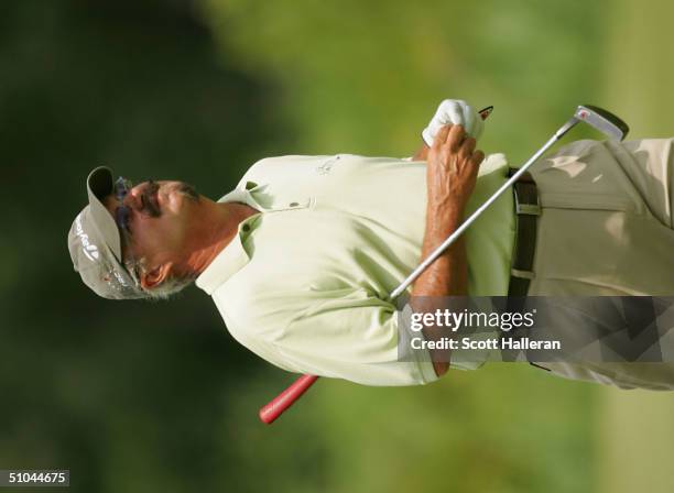 Gary McCord walks to the 18th green during the second round of the Ford Senior Players Championship at the TPC of Michigan on July 9, 2004 in...