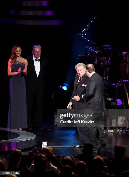 Singer Tony Bennett and pianist Bill Charlap walk onstage to accept the award for Best Traditional Pop Vocal Album for 'The Silver Lining: The Songs...