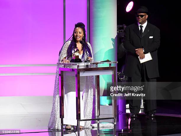 Singer Lalah Hathaway accepts the award for Best Traditional R&B Performance for 'Litlle Ghetto Boy' alongside record producer Jimmy Jam onstage...