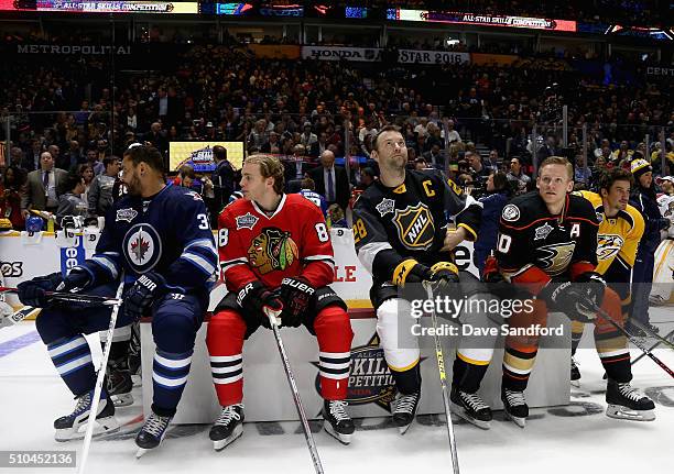 Players sit and watch the Honda NHL Breakaway Challenge during 2016 Honda NHL All-Star Skill Competition at Bridgestone Arena on January 30, 2016 in...