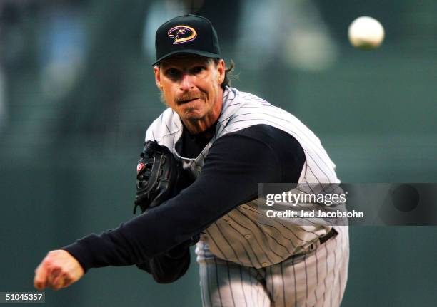 Randy Johnson of the Arizona Diamondbacks pitches against the San Francisco Giants on July 9, 2004 at SBC Park in San Francisco, California.