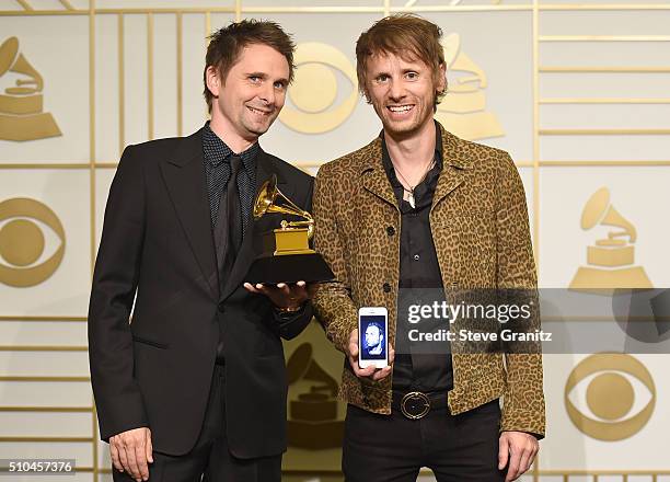 Recording artists Matt Bellamy and Dominic Howard of music group Muse, winners of Best Rock Album for 'Drones,' pose in the press room during The...