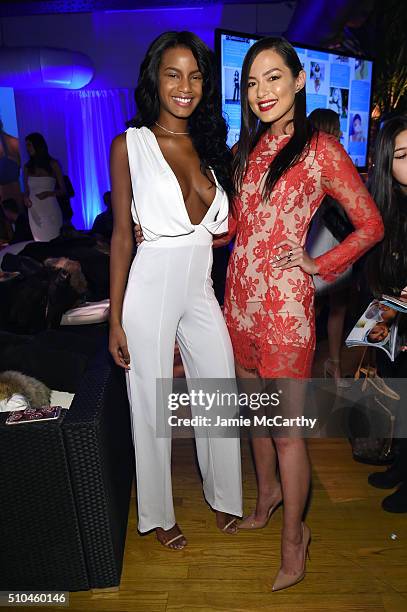 Models Ebonee Davis and Mia Kang pose together at the Sports Illustrated Swimsuit 2016 - Swim City at the Altman Building on February 15, 2016 in New...