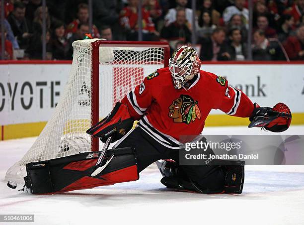 Scott Darling of the Chicago Blackhawks kicks the puck away for a save against the Toronto Maple Leafs at the United Center on February 15, 2016 in...