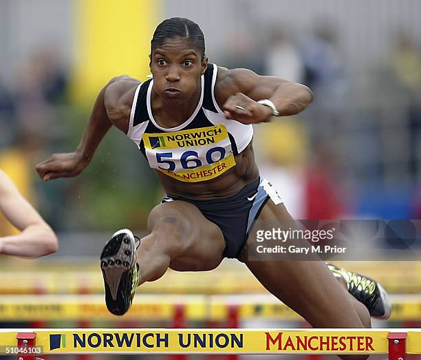 Denise Lewis competes in the 100m hurdles during the Norwich Union Olympic Trials and AAA Championships at the Manchester Regional Arena on July 10,...