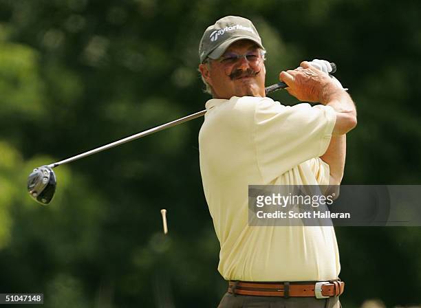 Gary McCord hits his tee shot on the ninth tee during the third round of the Ford Senior Players Championship at the TPC of Michigan on July 10, 2004...