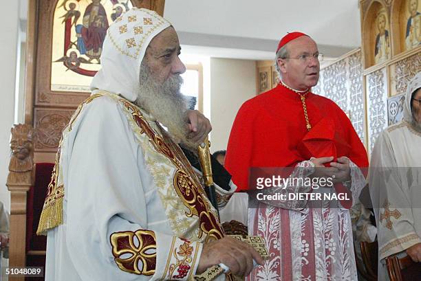 Patriarch of Egypt's Coptic Christian minority, Pope Shenouda and Austrian Roman-Catholic cardinal Christoph Schonborn are pictured during a mass and...