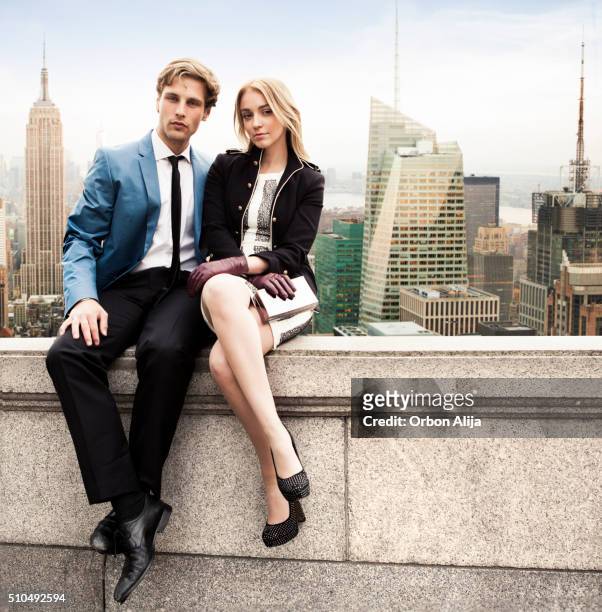 couple in new york rooftop - classic photos of the american skyscraper stock pictures, royalty-free photos & images