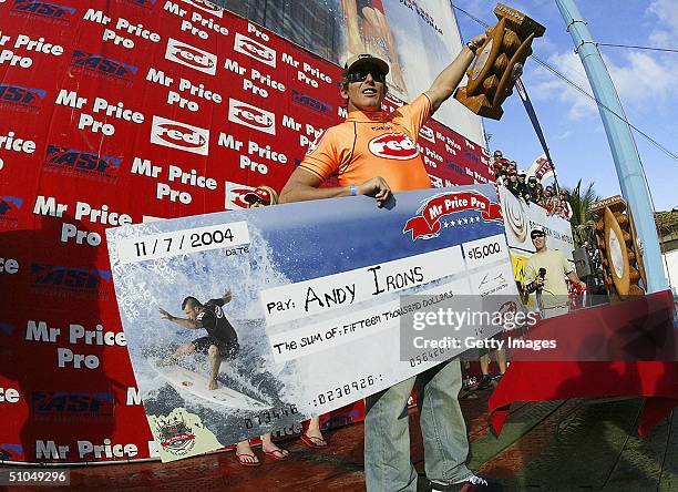 Two times reigning Association of Surfing Professionals world champion Andy Irons celebrates his win at the Mr Price Pro July 11, 2004 in North...