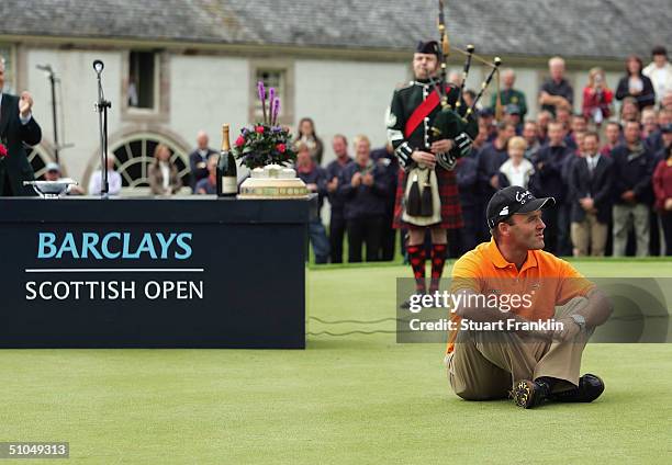 Thomas Levet of France listens to the singing of Flower of Scotland at The Barclays Scottish Open at Loch Lomond Golf Club, on July 11, 2004 in Loch...
