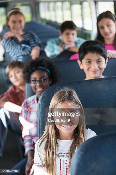 children riding school bus - arab student kids stock pictures, royalty-free photos & images