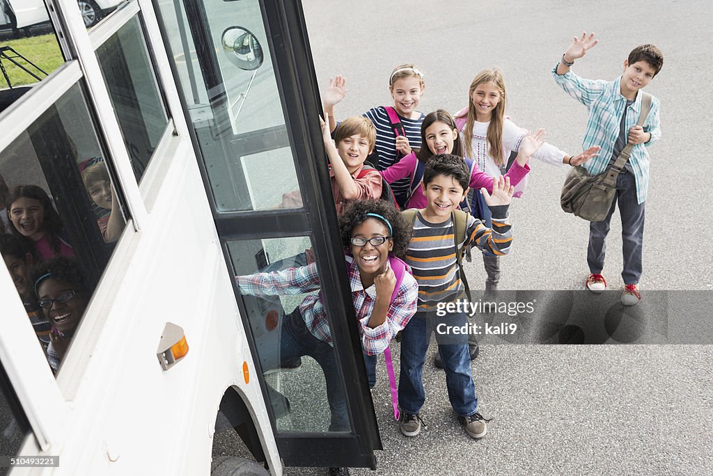 Children getting on school bus