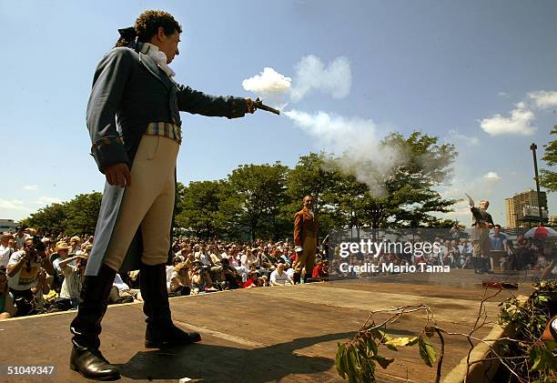 Antonio Burr , a descendant of Aaron Burr's cousin, fires with Douglas Hamilton , a fiith-great-grandson of Alexander Hamilton, during a reenactment...