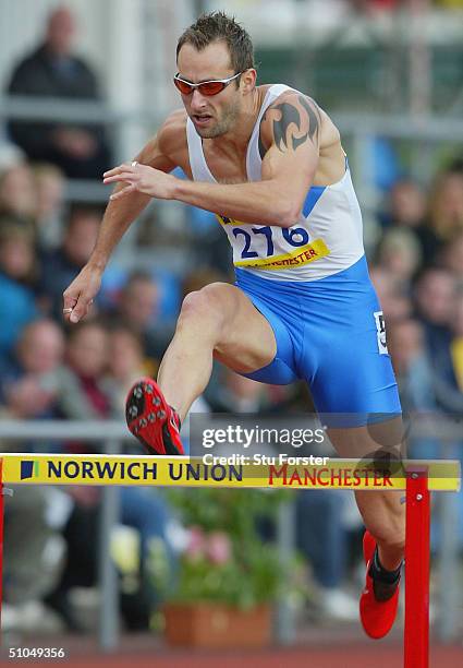 Chris Rawlinson competes on his way to winning the mens 400 metres Hurdles during the Norwich Union Athletics Olympic Trials at Manchester Regional...