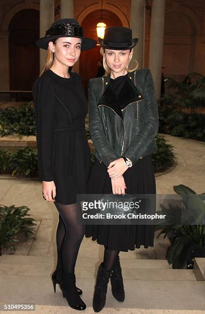 Cara Li and a friend attend the Carolina Herrera show during Fall 2016 New York Fashion Week in the Frick Museum on February 15, 2016 in New York...