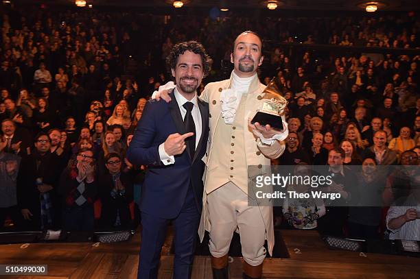 Music director Alex Lacamoire and Actor, composer Lin-Manuel Miranda celebrate on stage during "Hamilton" GRAMMY performance for The 58th GRAMMY...
