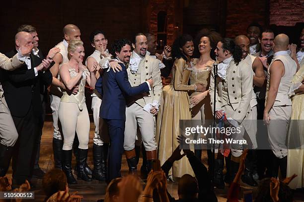 Music director Alex Lacamoire and actor, composer Lin-Manuel Miranda and cast of "Hamilton" celebrate on stage the receiving of GRAMMY award after...