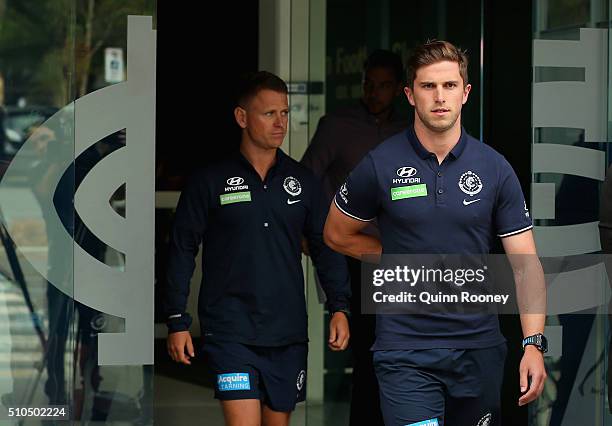 Brendon Bolton the coach and Marc Murphy the captain of the Blues walk out to speak to the media during a Carlton Blues AFL media session at Ikon...