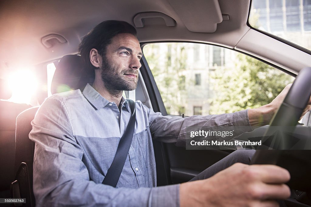 Businessman driving his car