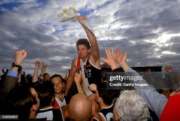 Danny Frawley of the Saints is chaired off the ground after his last match after the round 22 AFL match between the St Kilda Saints and Footscray...