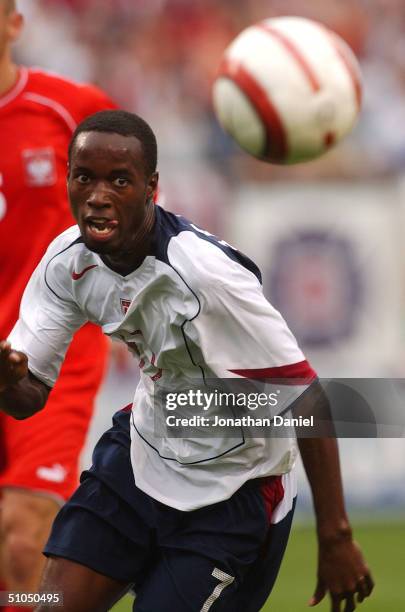 DaMarcus Beasley of the United States keeps his eye on the ball as he chases it down in the box during a game against Poland on July 11, 2004 at...