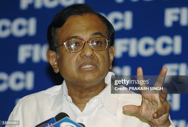 India's Finance Minister P. Chidambaram gestures as he delivers a speech to members of the Federation of Indian Chamber of Commerce and Industry in...