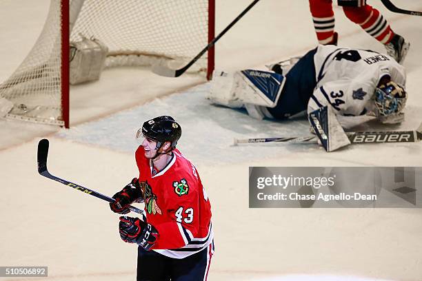 Viktor Svedberg of the Chicago Blackhawks reacts after scoring in the third period, as goalie James Reimer of the Toronto Maple Leafs lays in the...