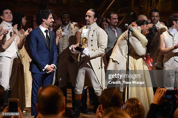 Music director Alex Lacamoire and actor, composer Lin-Manuel Miranda and cast of "Hamilton" celebrate on stage the receiving of GRAMMY award after...