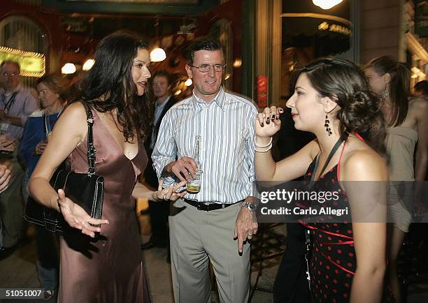 Actors Jill Hennessy and Vanessa Lengies talk to NBC exec Kevin Reilly at the NBC TCA All - Star Party at Univeral Studios July 11, 2004 in Los...