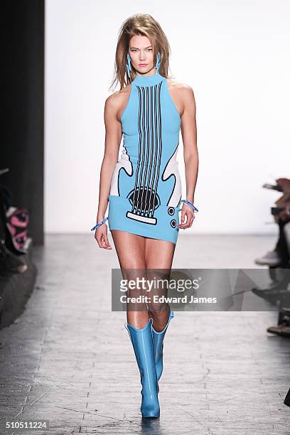 Karlie Kloss walks the runway during the Jeremy Scott fashion show at The Arc, Skylight at Moynihan Station on February 15, 2016 in New York City.