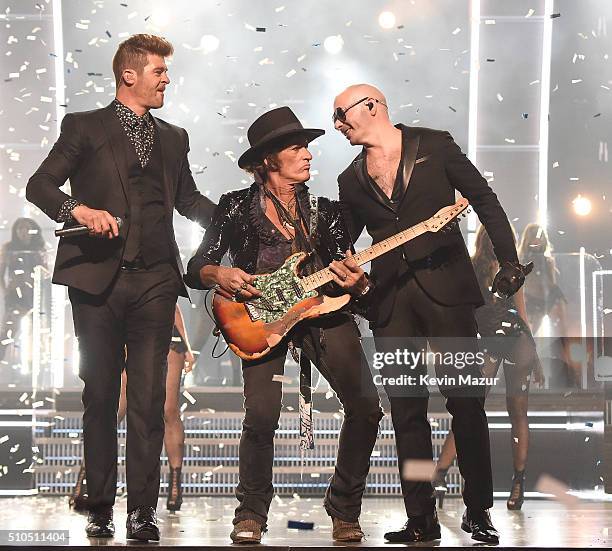Robin Thicke, Joe Perry and Pitbull perform onstage during The 58th GRAMMY Awards at Staples Center on February 15, 2016 in Los Angeles, California.
