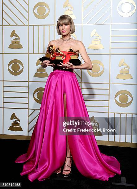 Singer Taylor Swift, winner of the awards for Album of the Year and Best Pop Album for "1989" and Best Music Video for "Bad Blood," poses in the...