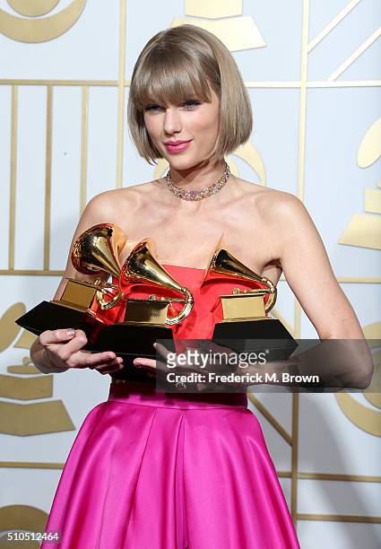 Singer Taylor Swift, winner of the awards for Album of the Year and Best Pop Album for "1989" and Best Music Video for "Bad Blood," poses in the...