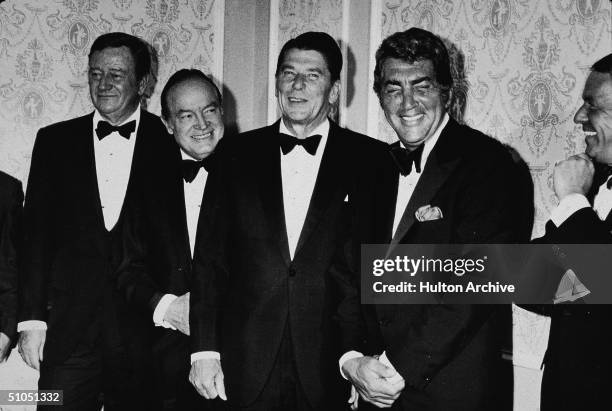 From left, American actor John Wayne , British-born American entertainer Bob Hope , California governor Ronald Reagan , American actor Dean Martin ,...