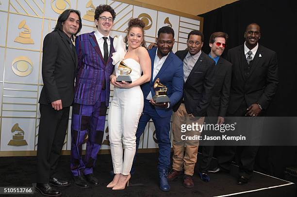 Songwriter Kendra Foster and The Vanguard celebrate her Best R&B Song trophy for 'Really Love' in the press room during The 58th GRAMMY Awards at...