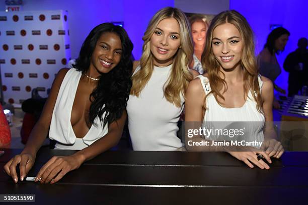 Models Ebonee Davis, Megan Williams and Caroline Kelley pose together at the Sports Illustrated Swimsuit 2016 - Swim City at the Altman Building on...