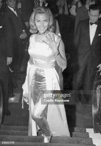 English actress Honor Blackman attends the premiere of the latest Bond film 'Goldfinger' at the Odeon, Leicester Square, 18th September 1964. One of...