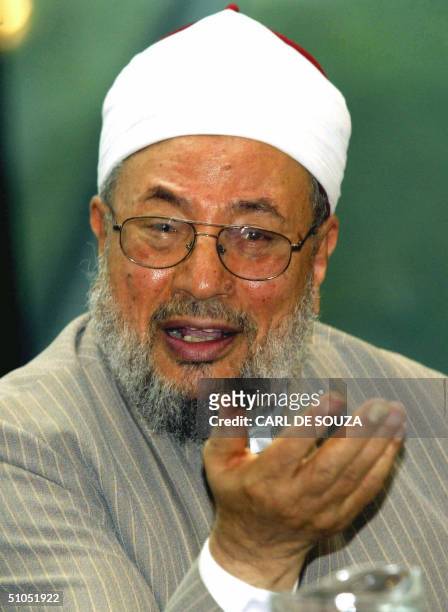 Muslim cleric Yussef al-Qaradawi gestures as he speaks during a conference hosted by London mayor Ken Livingstone at the City Hall, 12 July 2004,...