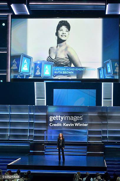 An image of Lifetime Achievement Award honoree the late Ruth Brown is displayed on a video screen as recording artist Bonnie Raitt speaks onstage...