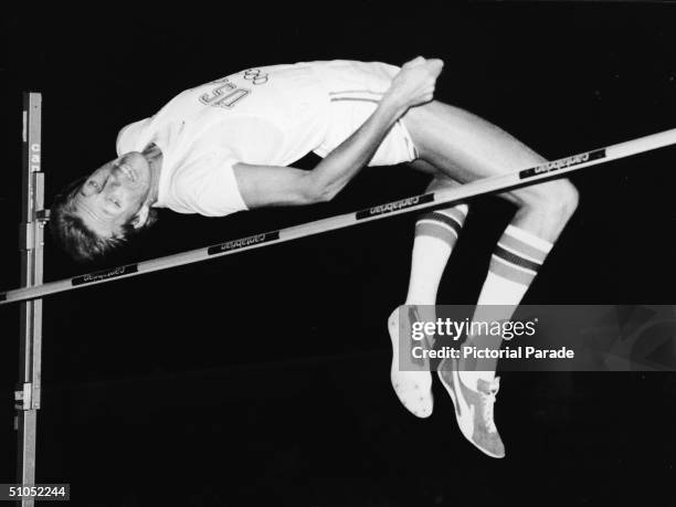 American athlete Dwight Stones clears a high jump to win his event during the Debenham Games at the Crystal Palace, London, England, September 18,...