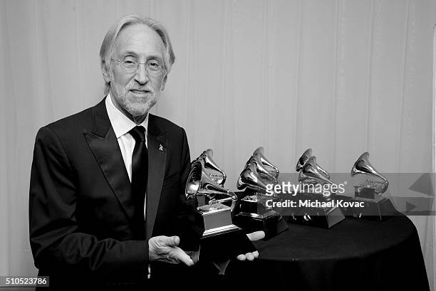 President/CEO of The Recording Academy and MusiCares Neil Portnow poses with GRAMMY trophies at The 58th GRAMMY Awards at Staples Center on February...
