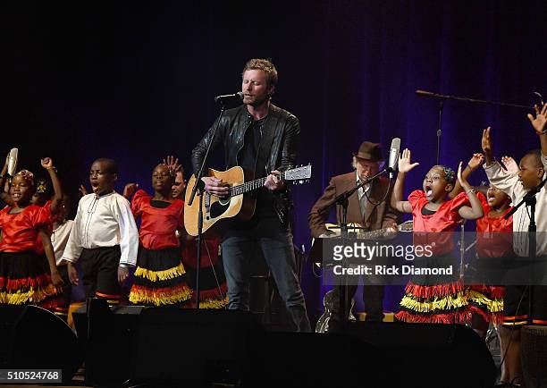 Singer/Songwriter Dierks Bentley performs with the African Children's Choir during "Nashville for Africa" to benefit the African Children's Choir at...