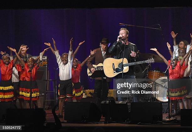 Singer/Songwriter Dierks Bentley performs with the African Children's Choir during "Nashville for Africa" to benefit the African Children's Choir at...