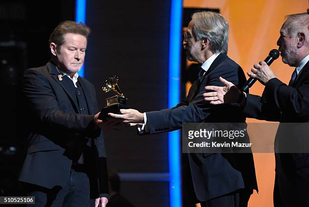 National Academy of Recording Arts and Sciences President Neil Portnow presents musician Don Henley of the Eagles with the band's 1977 Record of the...
