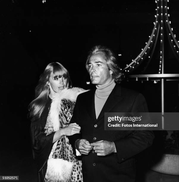 American film director John Derek and his wife, actor Linda Evans, attend the opening night performance by Sonny and Cher at the Century Plaza Hotel,...