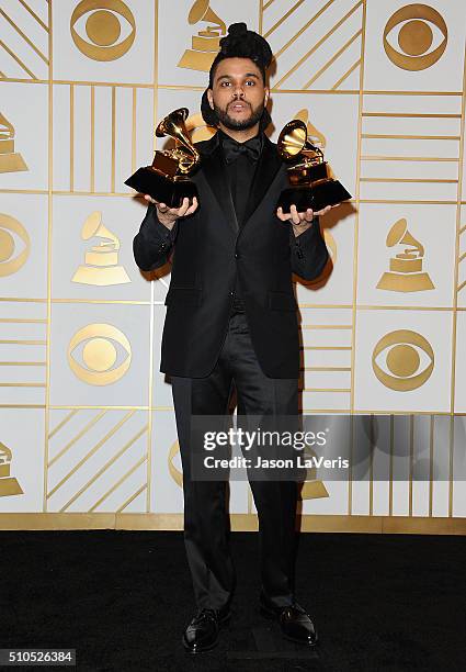 The Weeknd poses in the press room at the The 58th GRAMMY Awards at Staples Center on February 15, 2016 in Los Angeles, California.