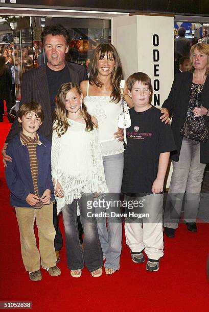 Paul and Stacey Young with family arrive at the UK film premiere of "Spider-Man 2" at the Odeon Leicester Square, on July 12, 2004 in London.